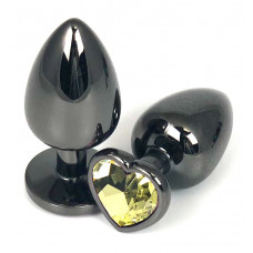 Черная металлическая анальная пробка с желтым стразом-сердечком - 6,5 см.